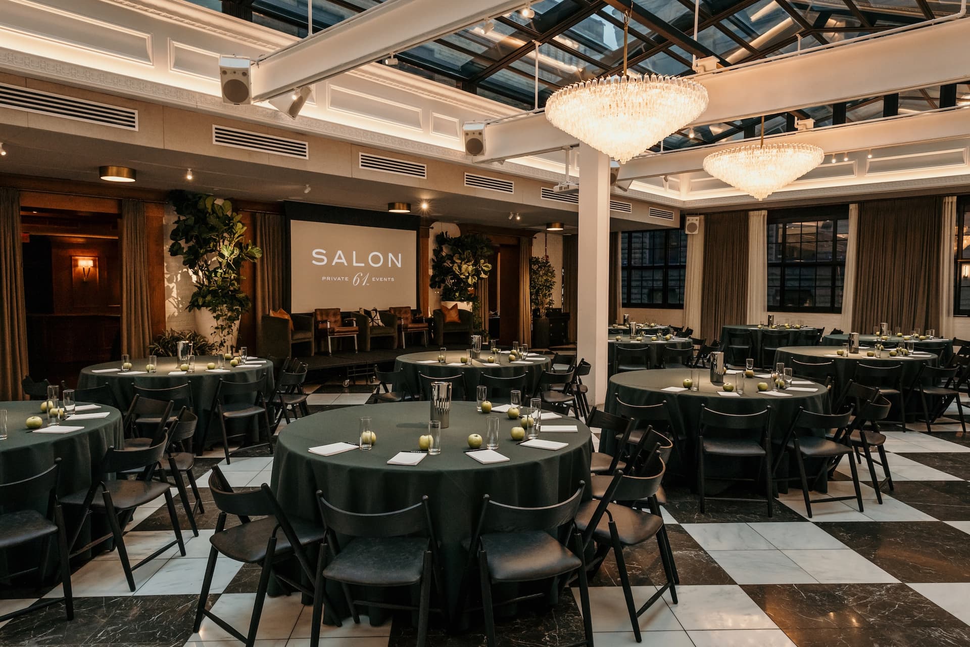Meeting room with many chairs facing a projector screen