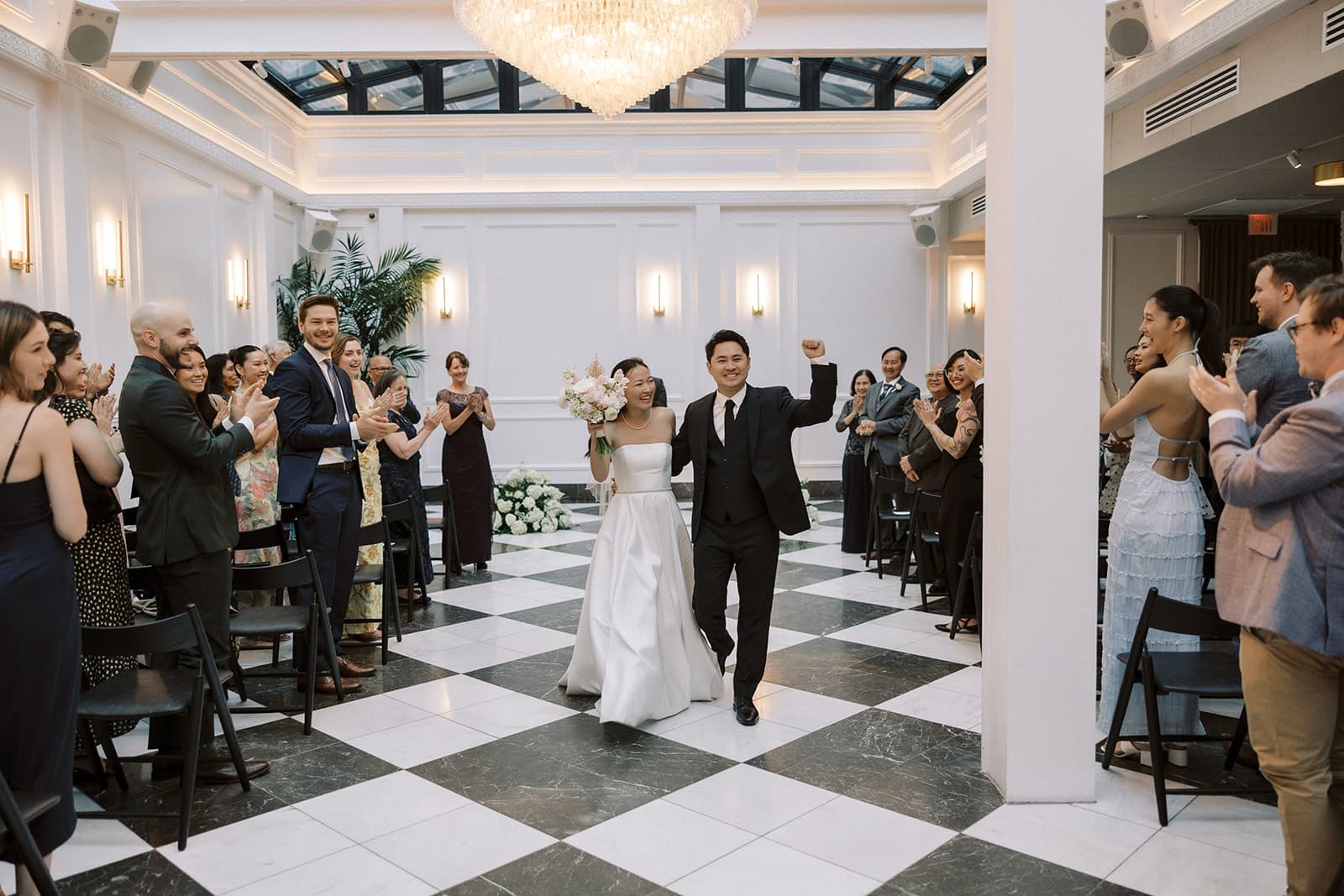 Atrium room with chandelier and cream linens